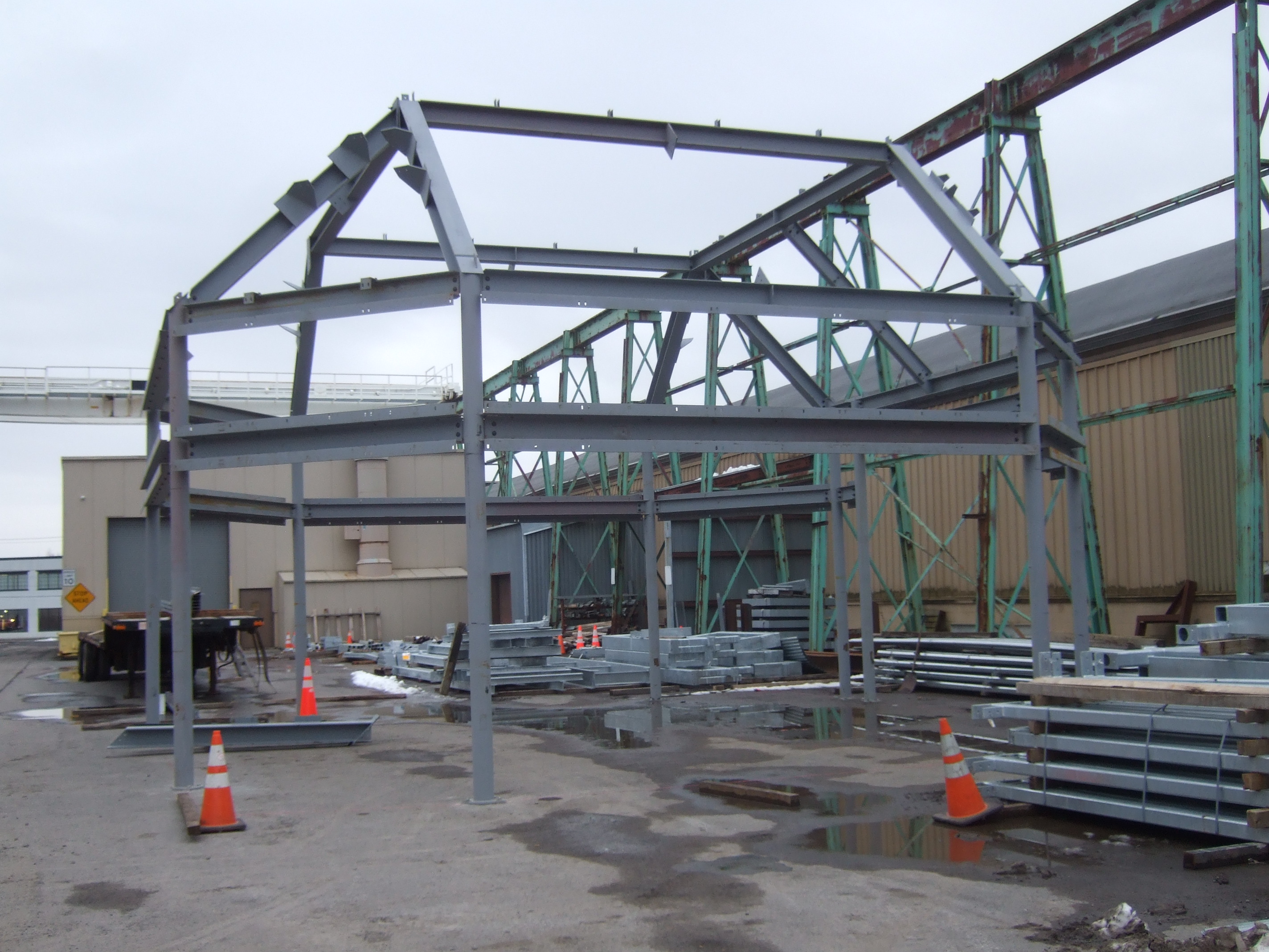 A large steal frame in an outdoor construction yard