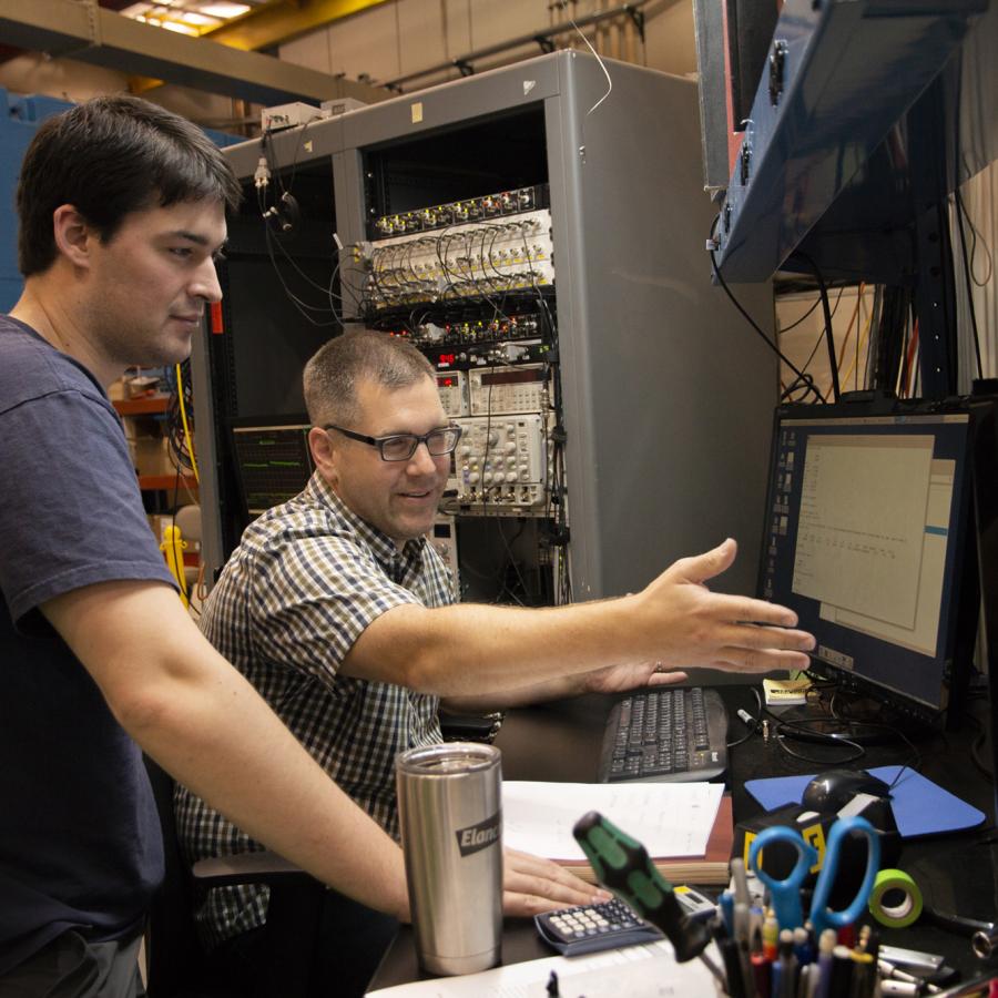 Justin Mach, right, from Caterpillar works with CHESS Graduate Student Chris Budrow during Justin's latest beam time. 