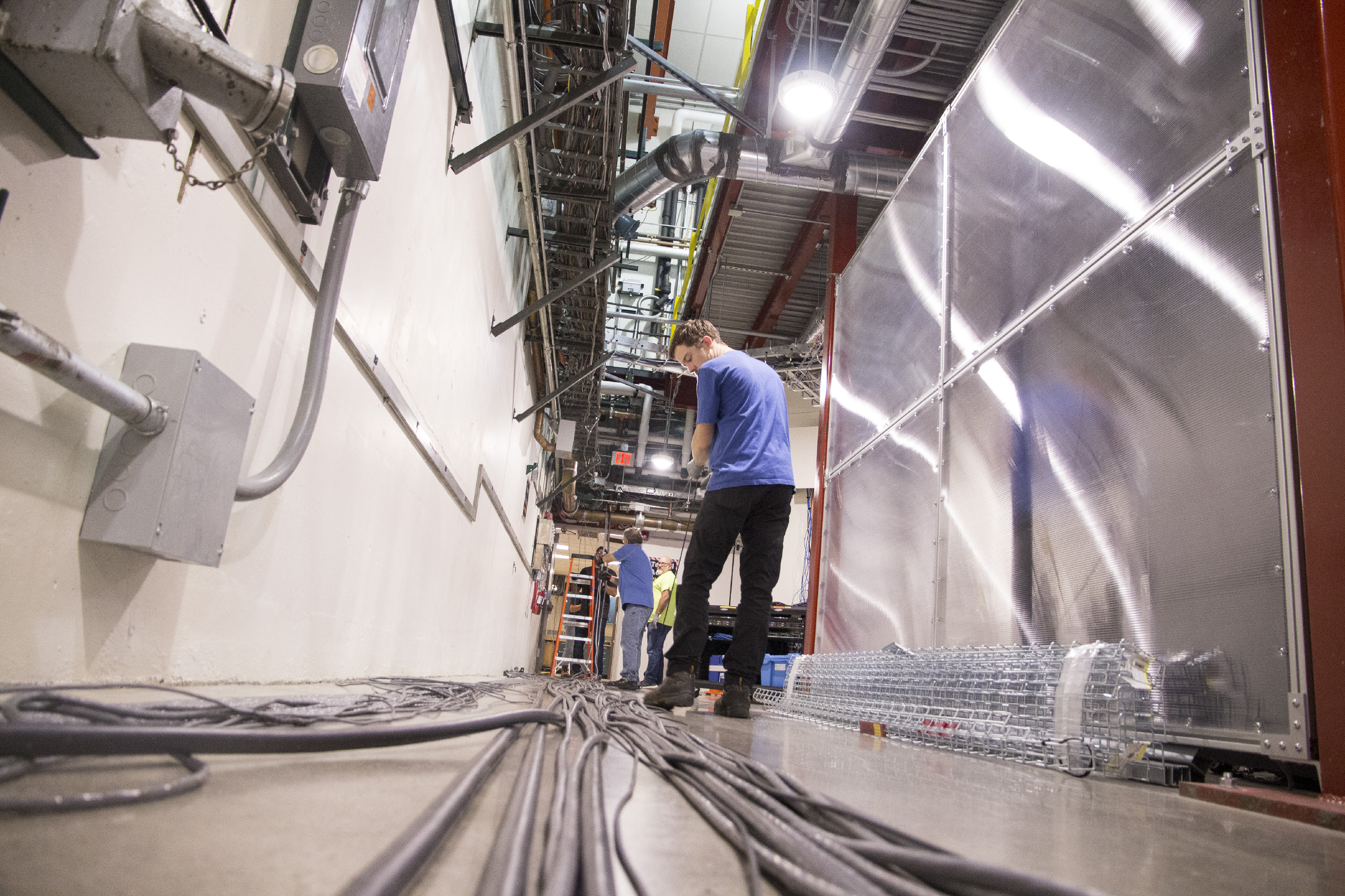 image of people laying out cables