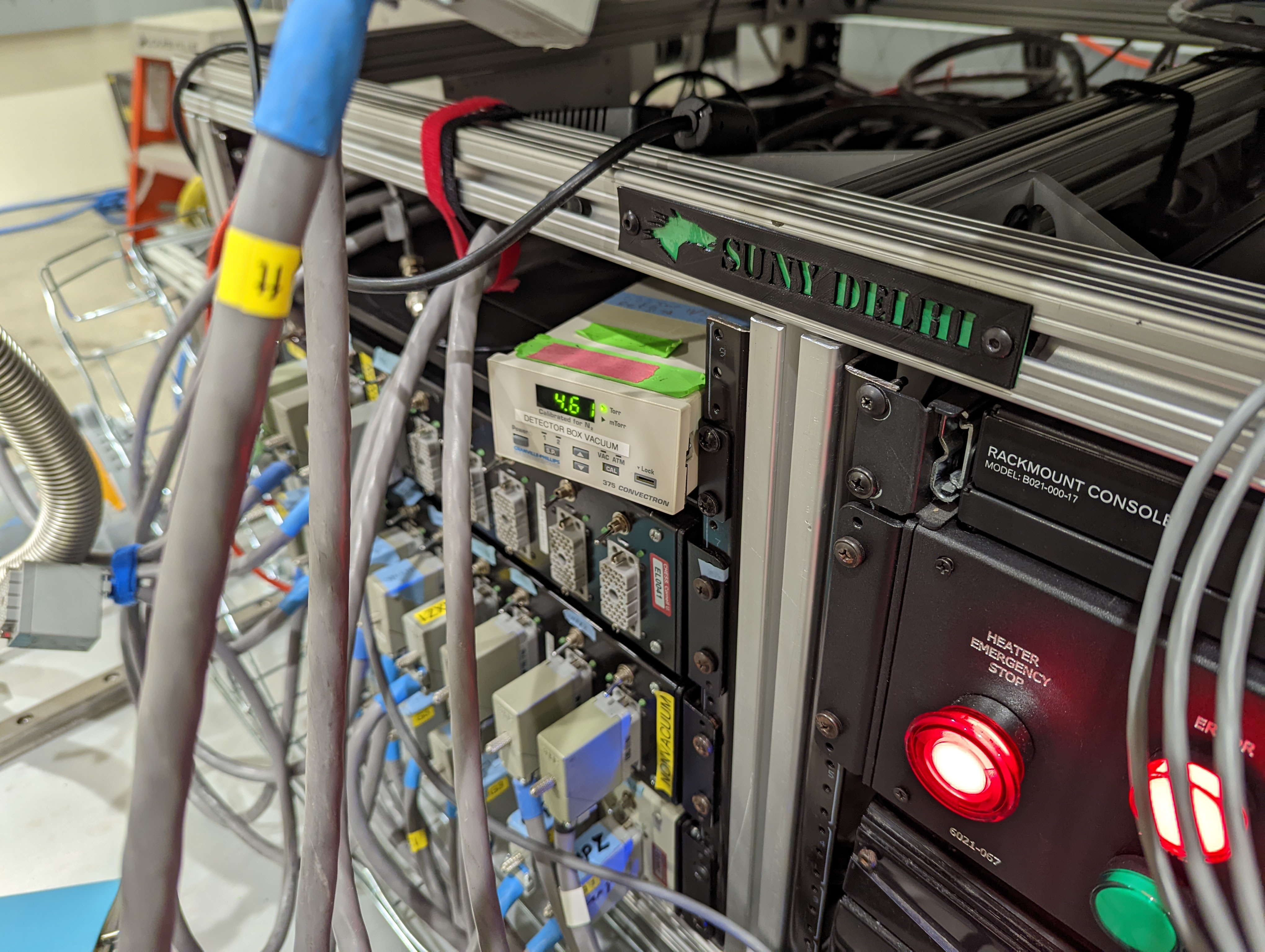 Image of a rack containing electronics. A label on the front reads "SUNY Delhi"