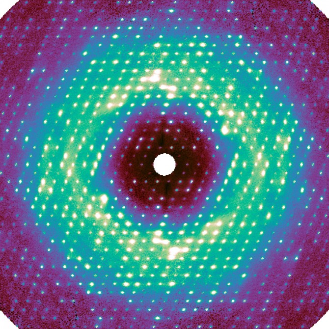 This slice through the three-dimensional diffuse map shows intense peaks resulting from lattice vibration, as well as cloudy features caused by internal protein motions.