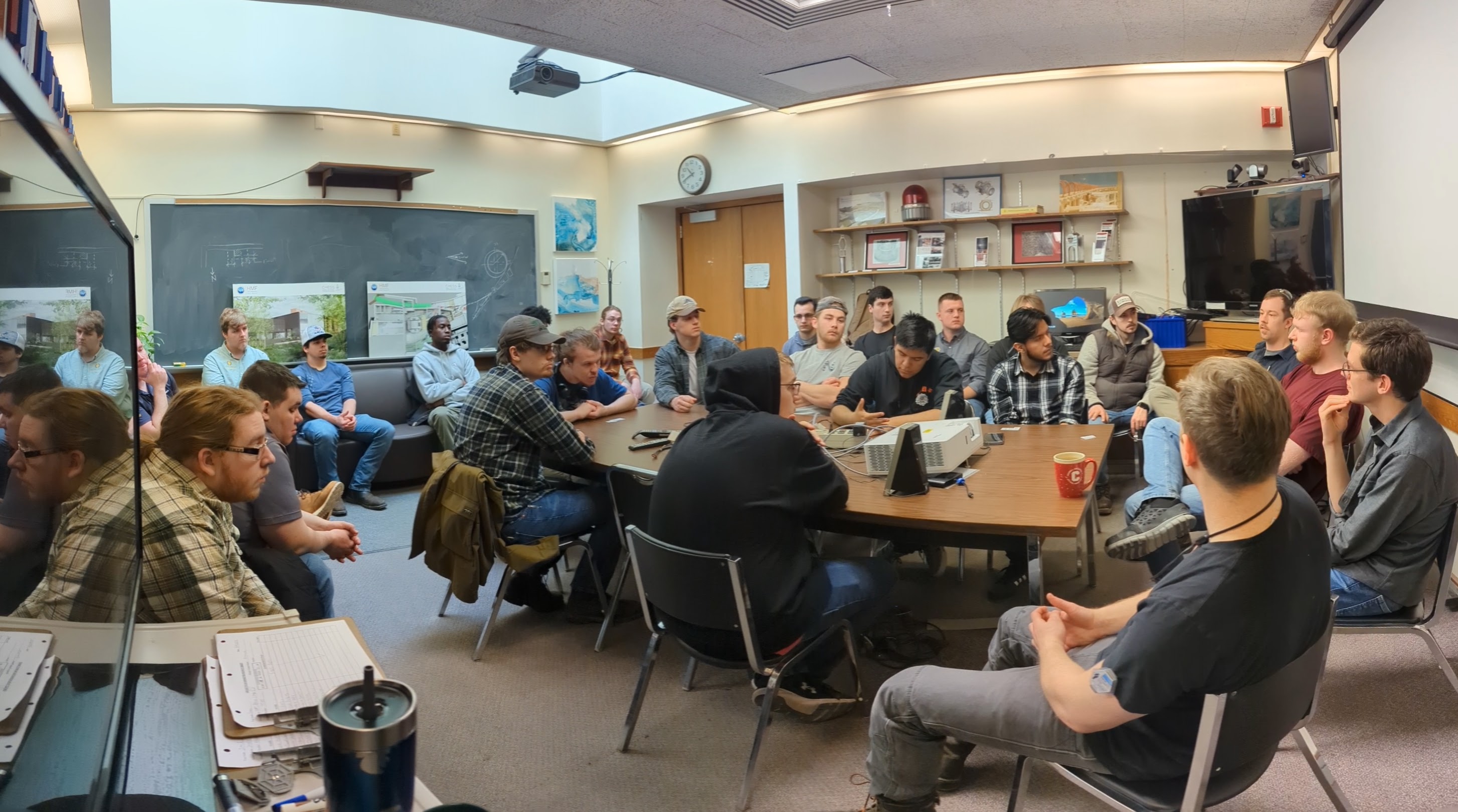 Image of people in a conference room.