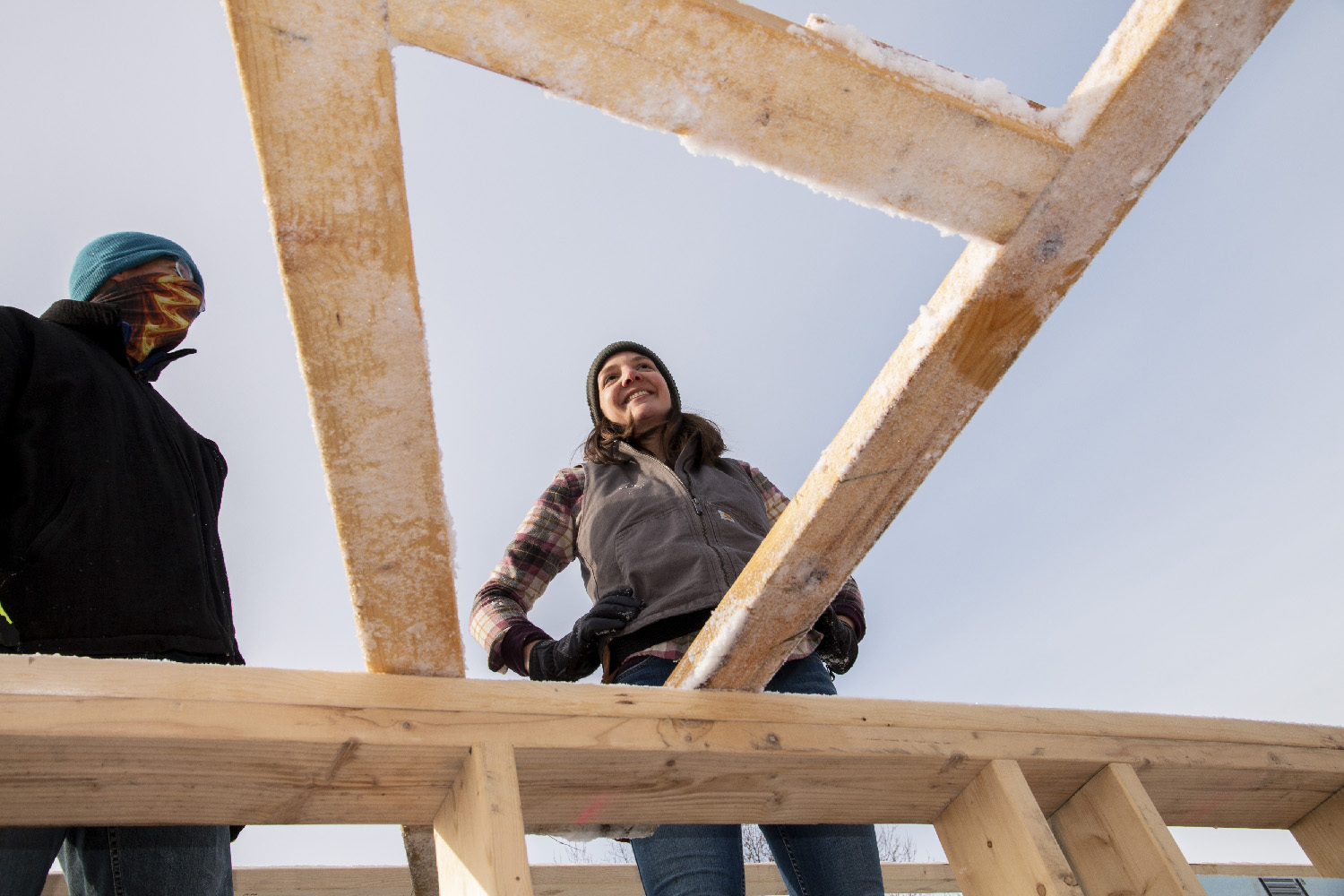 Elisabeth helps install a truss at the Habitat for Humanity site