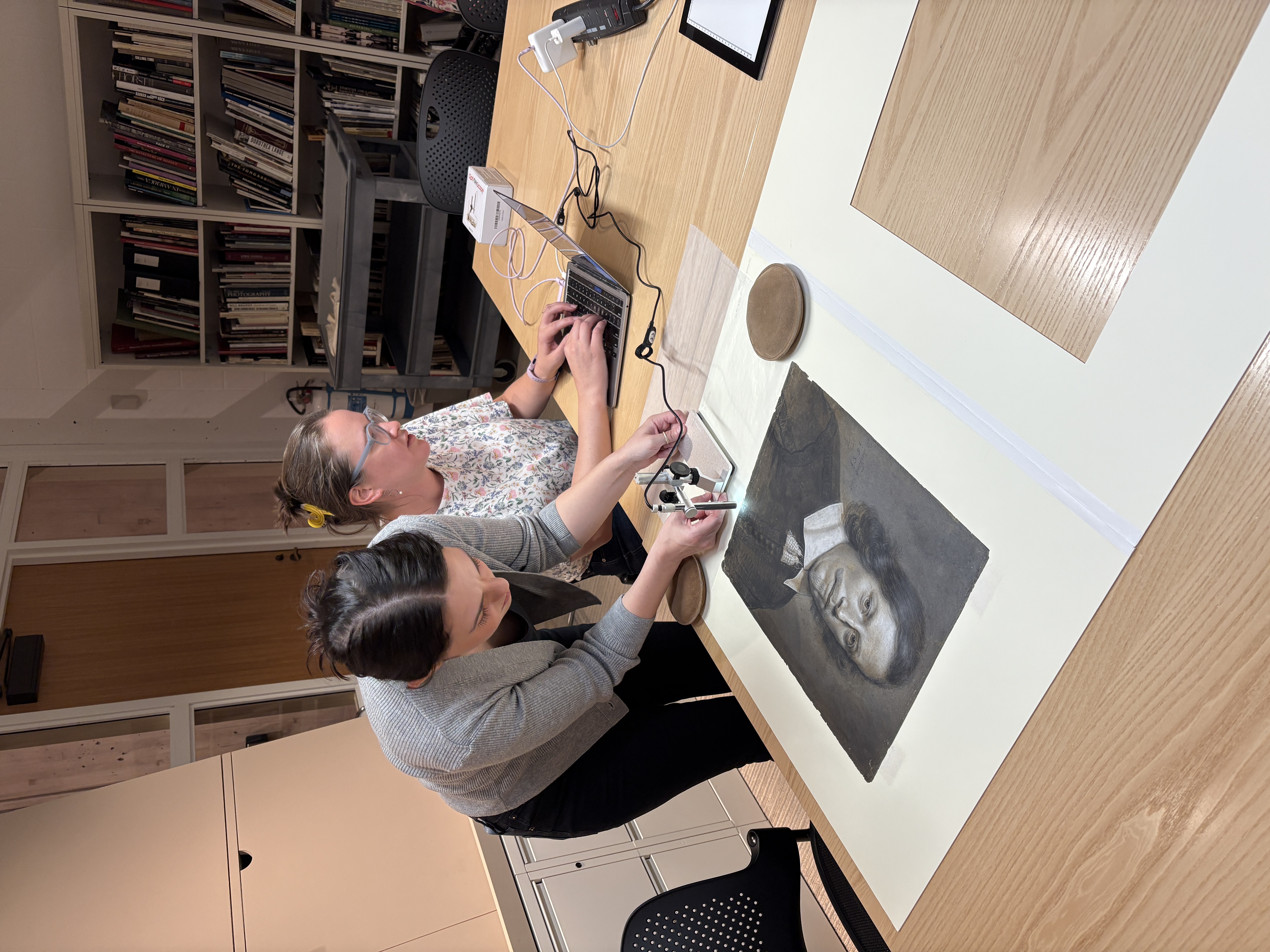 Brittany Rubin and Louisa Smieska examine a drawing at HFJ