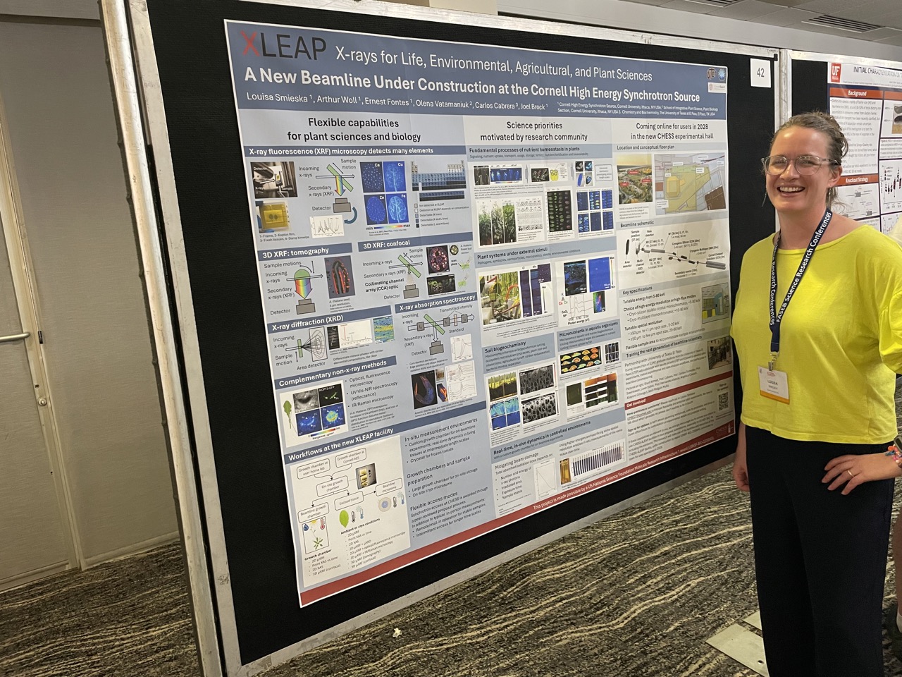 Louisa Smieska stands in front of her poster