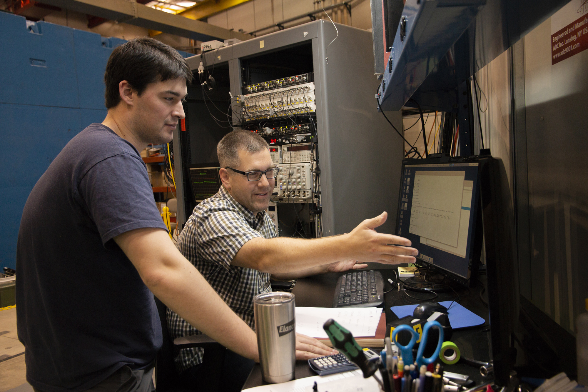 Justin Mach, right, from Caterpillar works with CHESS Graduate Student Chris Budrow during Justin's latest beam time. 