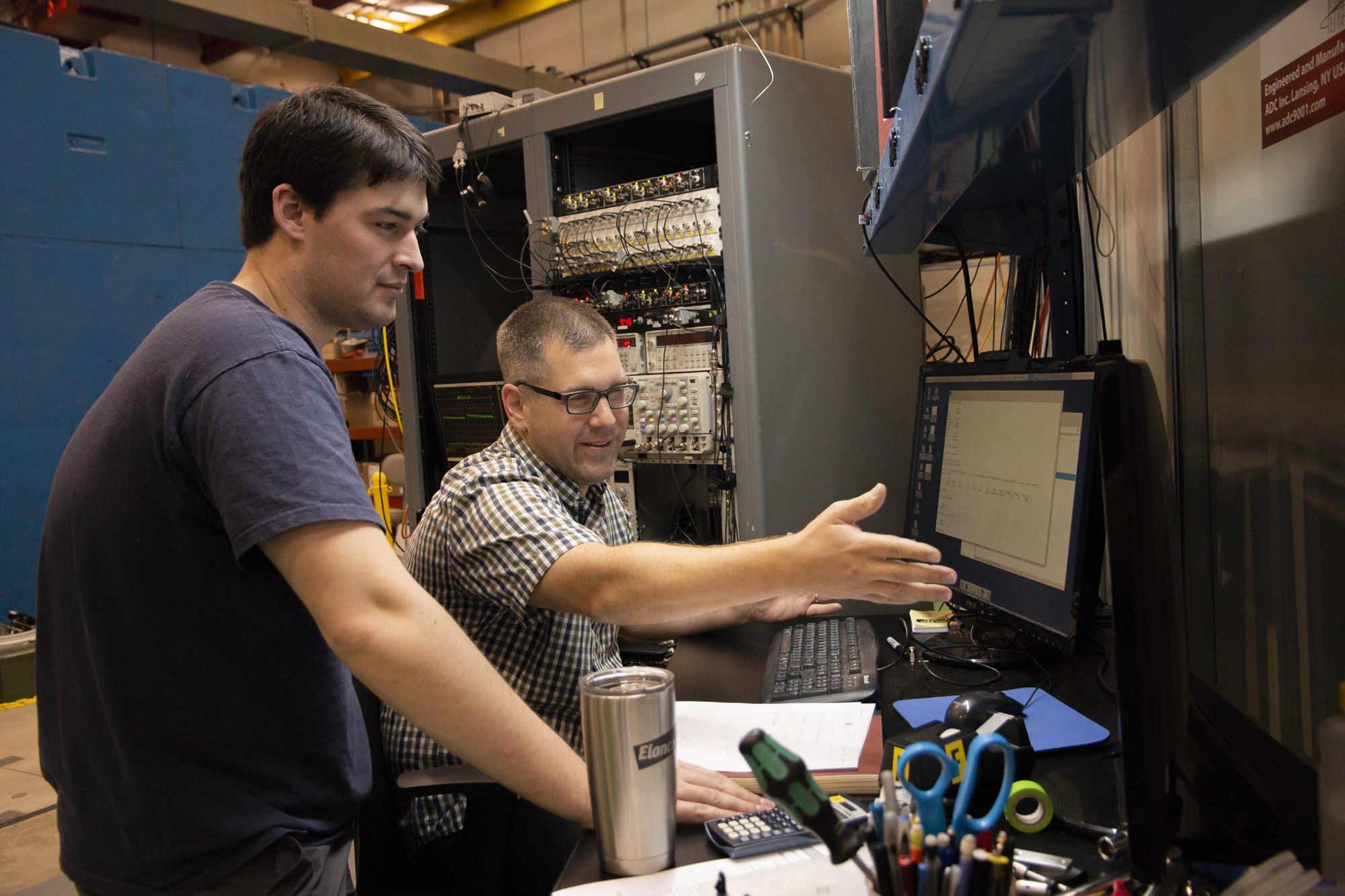 Justin Mach, right, from Caterpillar works with CHESS Graduate Student Chris Budrow during Justin's latest beam time.