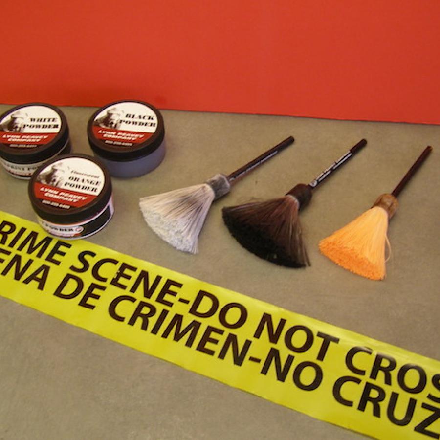 A series of brushes and powders used for fingerprinting