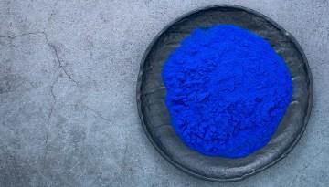 image of a bowl of vibrant blue powder