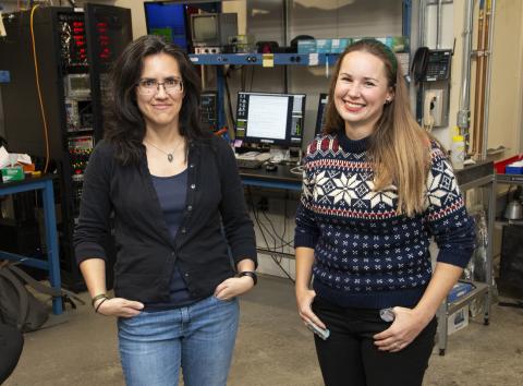 Image of two people posing at a CHESS beamline