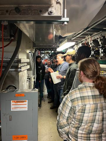 Image of students inside the synchrotron tunnel.