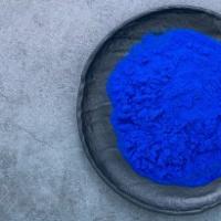 image of a bowl of vibrant blue powder