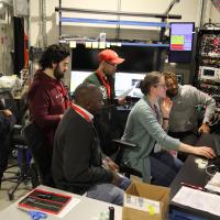 students at beamline