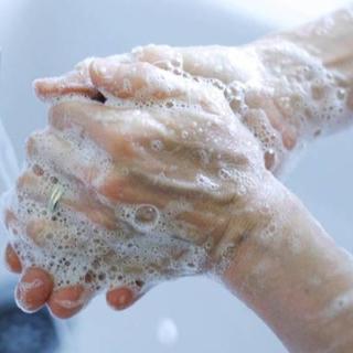 Woman washing hands at CHESS