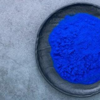 image of a bowl of vibrant blue powder