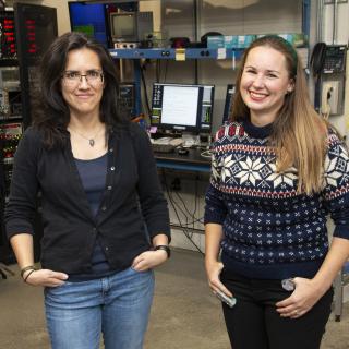 Image of two people posing at a CHESS beamline