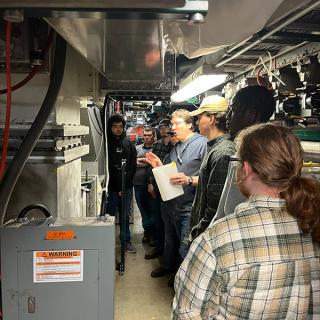 Image of students inside the synchrotron tunnel.