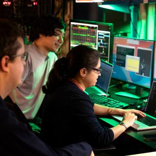 researchers at the beam line