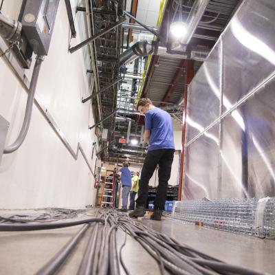 image of people laying out cables