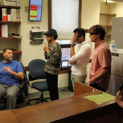 David Schuller shows students how 3D glasses are used to visualize protein structures in PyMOL